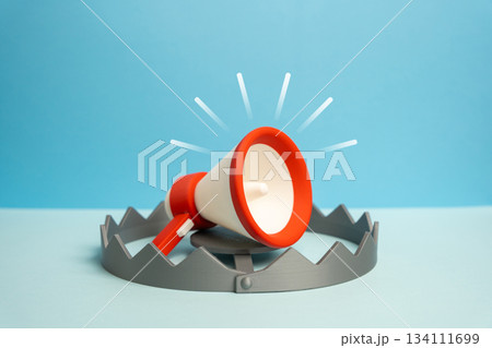 A megaphone as bait in a trap. Imaginary freedom of speech and expression. Persecution of dissent. Manipulated communication. Media freedom and political commentary. 134111699