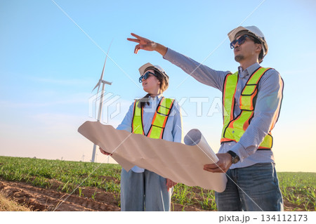 Engineer working at Wind turbine fields Engineer working at Wind turbine fields 134112173