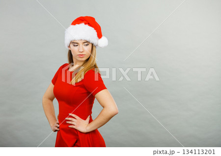 Woman wearing Santa Claus helper costume Woman wearing Santa Claus helper costume 134113201