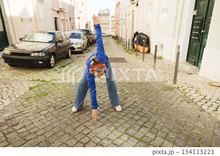 Cobbled street spectacle with lively acrobatics and bright energy Cobbled street spectacle with lively acrobatics and bright energy 134113221
