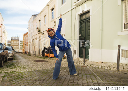 Casual street style captured with architectural accents and lighting Casual street style captured with architectural accents and lighting 134113445