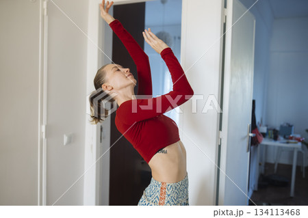 An intimate solo dance routine captured in gentle natural illumination 134113468
