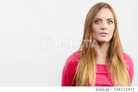 Woman looking shocked Woman looking shocked 134113472