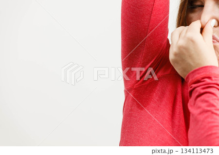 Woman sweating very badly have wet armpit 134113473