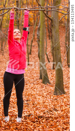 Young sporty girl doing exercises in forest. Young sporty girl doing exercises in forest. 134113495