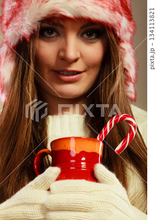 Christmas girl with mug and cane. Christmas girl with mug and cane. 134113821