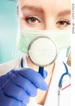 Specialist in mask with stethoscope. 134113829