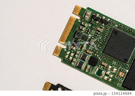 Angle view of M.2 SSD edge connector and circuitry with copy space 134114084