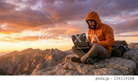 Man Laptops on Mountain 134114106