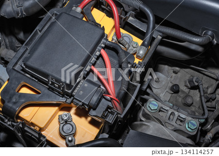 Car battery in the engine compartment Car battery in the engine compartment 134114257