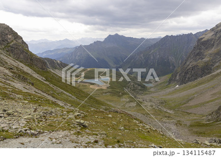 Hiking the Smugglerpfad trail in Gargellen, Montafon, Vorarlberg, Austria with views of mountains and valleys Hiking the Smugglerpfad trail in Gargellen, Montafon, Vorarlberg, Austria with views of mountains and valleys 134115487