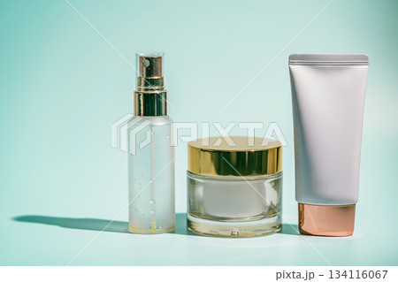 Three skincare products on blue Three skincare products on blue 134116067