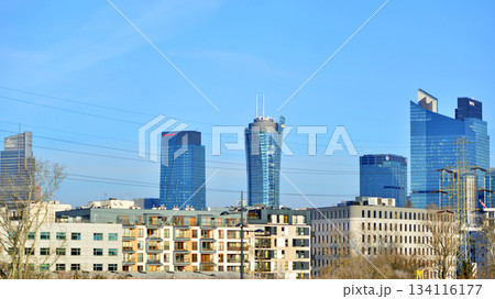 Warsaw, Poland. 28 November 2025. A panorama of the city with skyscrapers. In the foreground are high-voltage cables for electric trains at Warszawa Zachodnia station. Warsaw, Poland. 28 November 2025. A panorama of the city with skyscrapers. In the foreground are high-voltage cables for electric trains at Warszawa Zachodnia station. 134116177
