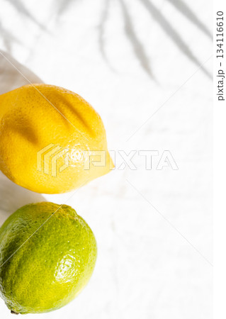 Lime and lemon in sunlights, close up view. Lime and lemon in sunlights, close up view. 134116610
