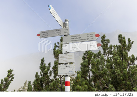Signpost located near Wiegensee in Gaschurn, Montafon, Vorarlberg, Austria, showing various hiking routes and times 134117322
