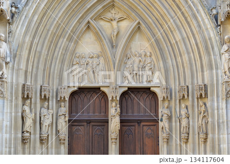 Gothic Cathedral Portal with Religious Sculptures and Medieval Stone Carvings Gothic Cathedral Portal with Religious Sculptures and Medieval Stone Carvings 134117604