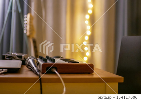 Home Music Studio with MIDI Keyboard and Microphone Home Music Studio with MIDI Keyboard and Microphone 134117606