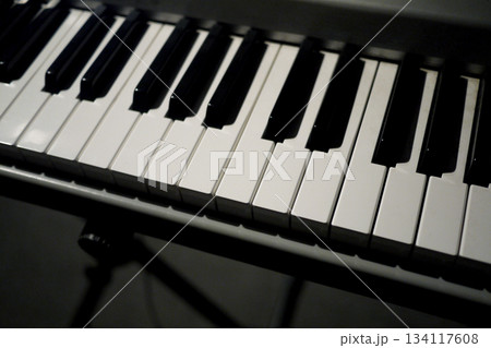 Digital Piano Keyboard Close-Up with Black and White Keys 134117608