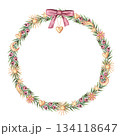 Tiny Christmas wreath of yew branches and gold celestial decor in the circle shape. Hand painted watercolor. Pink and green create a soft winter mood. Good for festive frame template and card design. 134118647
