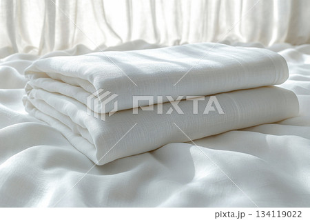 Neutral color. Cotton sheets on a white background. Stack of comfortable white sheets. 134119022