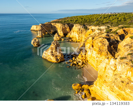 Marinha Beach, Cliffs and Atlantic Ocean on Sunny Day. Aerial View. Portugal 134119383