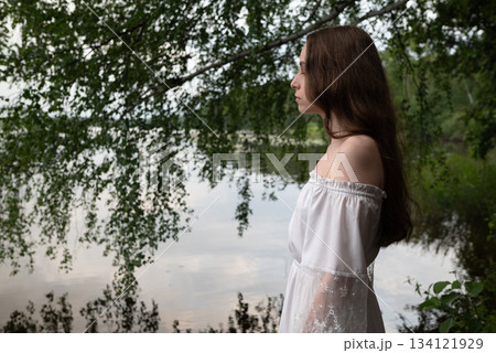 Whispers of Serenity: Woman in White Off-Shoulder Dress by Birch-Lined Lake 134121929