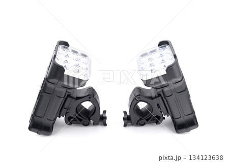 two identical black led bicycle lights with handlebar mounts, isolated on white 134123638