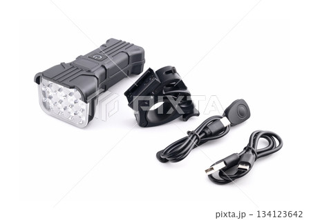 led bicycle light with mount and two usb cables, isolated on a white background, studio shot led bicycle light with mount and two usb cables, isolated on a white background, studio shot 134123642