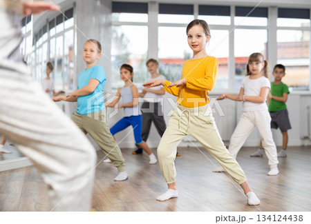 Group of children dancing modern dances Group of children dancing modern dances 134124438