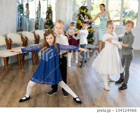 Children rehearsing ballroom dance for upcoming Christmas party at school 134124568