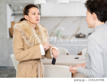 Mother leaving house, son staying home 134124706