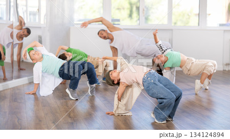 Preteen girl performing hip hop in group class for kids Preteen girl performing hip hop in group class for kids 134124894