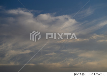 A Dreamy Cloudscape Displaying Under a Beautiful Blue Sky Full of Soft, Fluffy Clouds 134125259