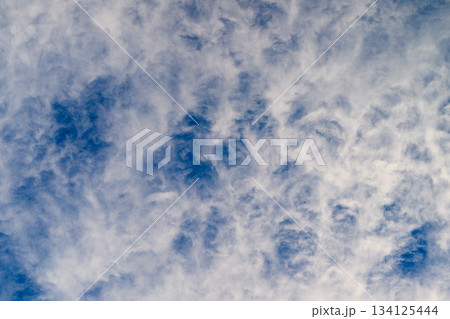 The Serene and Beautiful Cloud Patterns Against a Clear Blue Sky on a Bright Day The Serene and Beautiful Cloud Patterns Against a Clear Blue Sky on a Bright Day 134125444
