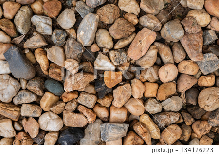 Full frame shot of gravel texture and background used for decoration or design garden. Gravel is rock that is of a certain particle size range. Full frame shot of gravel texture and background used for decoration or design garden. Gravel is rock that is of a certain particle size range. 134126223