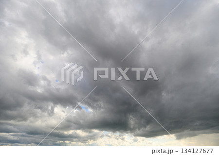 The overcast sky is filled with various gray shades, creating a captivating atmosphere The overcast sky is filled with various gray shades, creating a captivating atmosphere 134127677