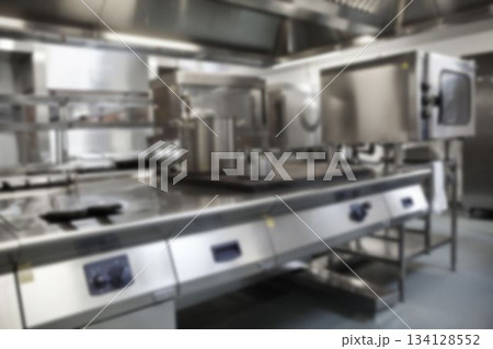 Utensils on stove in commercial kitchen 134128552
