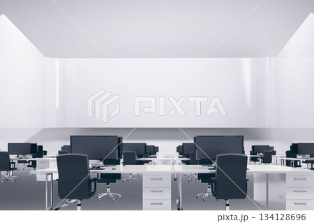 Open-plan office workspace is featuring flat design with white desks, gray chairs, black monitors 134128696