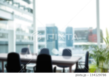 Flat design is showing wood conference table with swivel chairs and potted plant by windows 134129786
