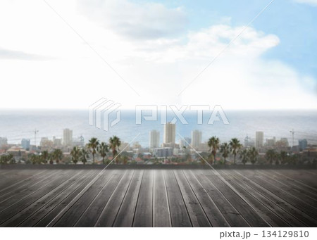 Flat design wooden deck flooring is featuring palm trees, city skyline and ocean under clouds 134129810