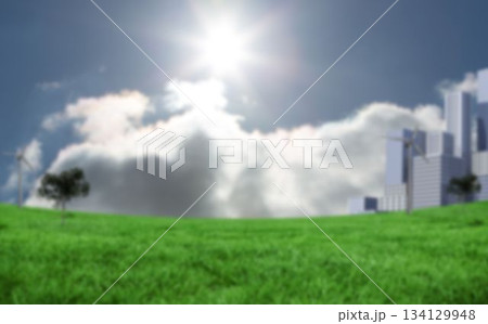 Grassy field and building against sky 134129948