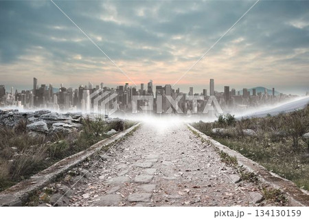 Stony path leading to large city on the horizon Stony path leading to large city on the horizon 134130159