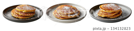 Stack of fluffy golden pancakes sprinkled with powdered sugar on a ceramic plate, isolated on white background Stack of fluffy golden pancakes sprinkled with powdered sugar on a ceramic plate, isolated on white background 134132823