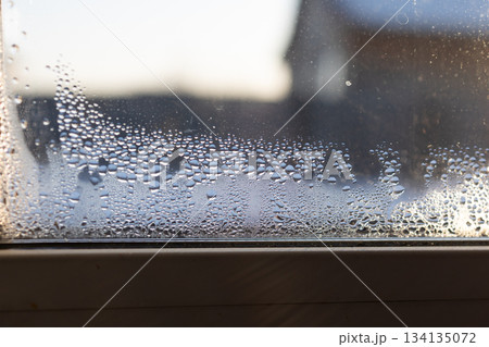 Window Condensation Indicates Poor Ventilation and Potential Mold Risk in House Window Condensation Indicates Poor Ventilation and Potential Mold Risk in House 134135072
