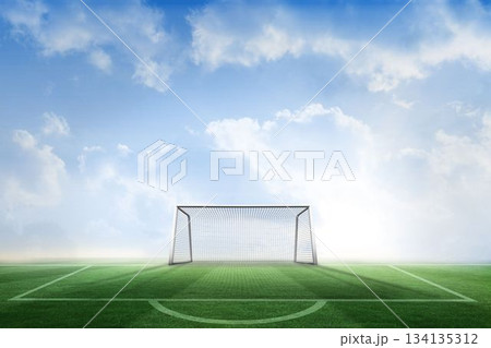 Football pitch and goal under blue sky 134135312