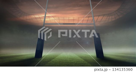 Flat design rugby goal posts are rising from misty striped grass pitch under dramatic twilight sky 134135360