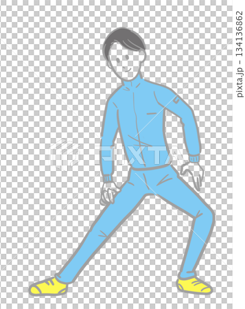 A young man in a blue jersey doing flexibility exercises 134136862