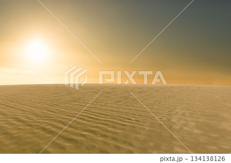 Flat design desert landscape is showing rippled dunes casting shadows under warm glowing sun 134138126