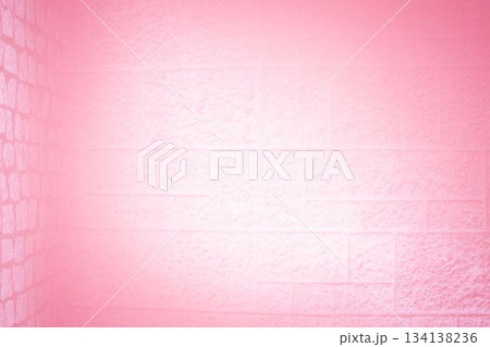 3D render is showing textured pink-painted brick block wall corner glowing under pink lighting 134138236