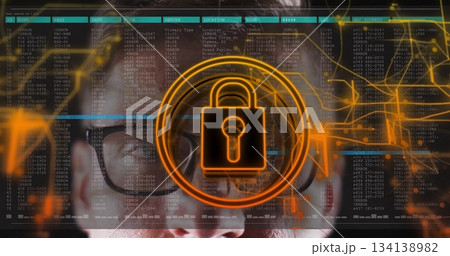 Mid adult man wearing eyeglasses analyzing code streams in workspace with padlock icon Mid adult man wearing eyeglasses analyzing code streams in workspace with padlock icon 134138982